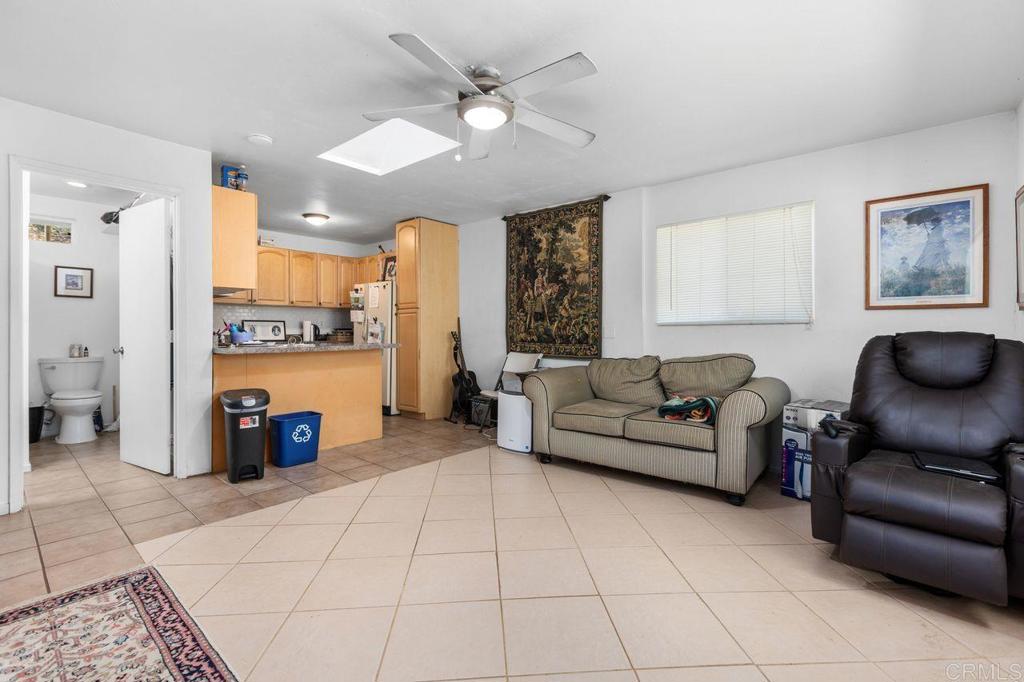 29560 Lilac Road Valley Center, CA 92082 - Photo 27 of 43 a living room with furniture and a fireplace