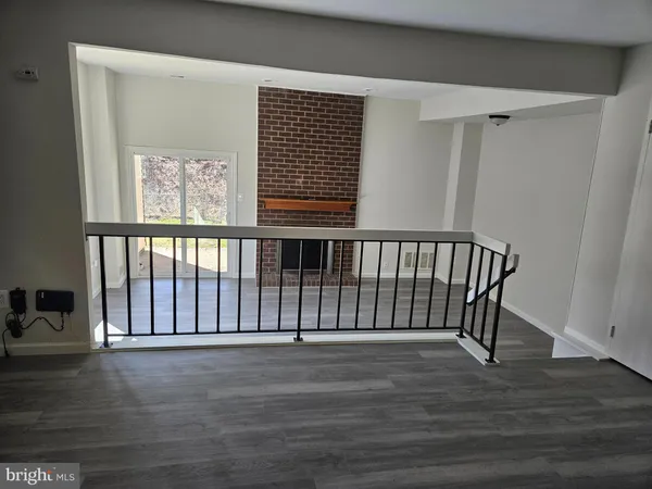a view of entryway with stairs and wooden floor