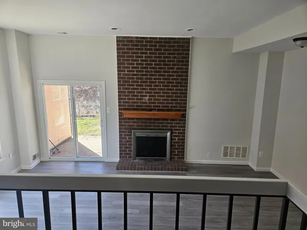 a view of wooden floor and a living room