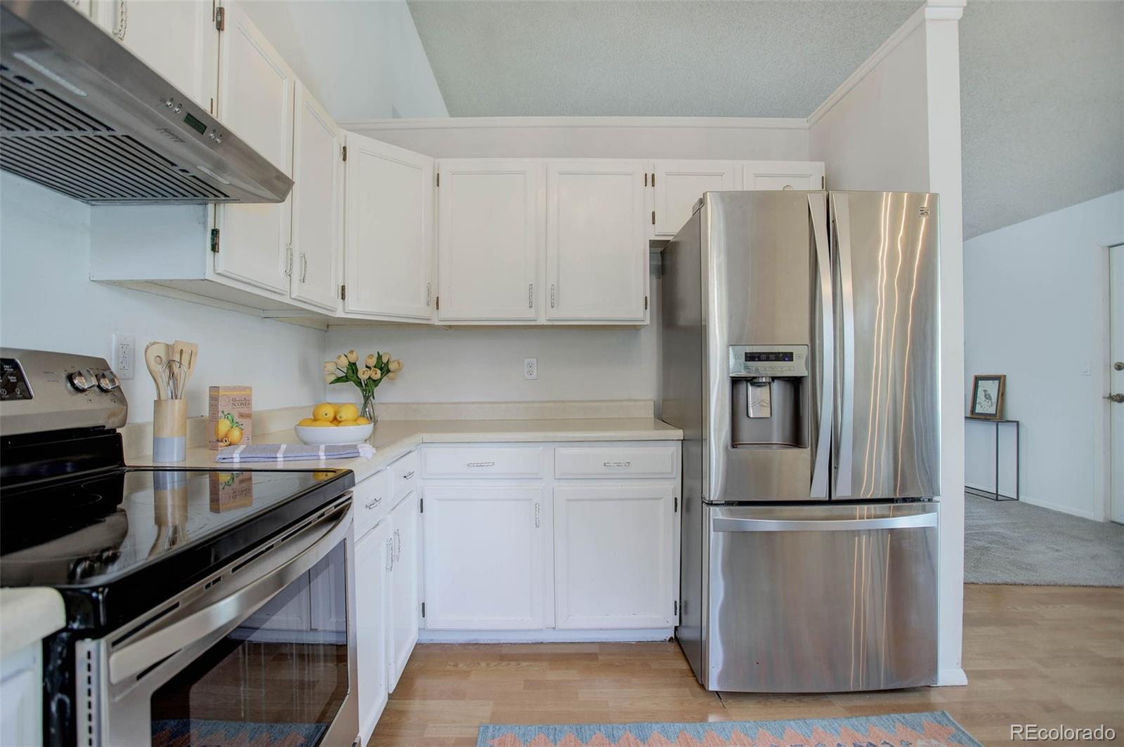 7359 Brook Forest Way Evergreen, CO 80439 - Photo 14 of 40 a kitchen with appliances and cabinets