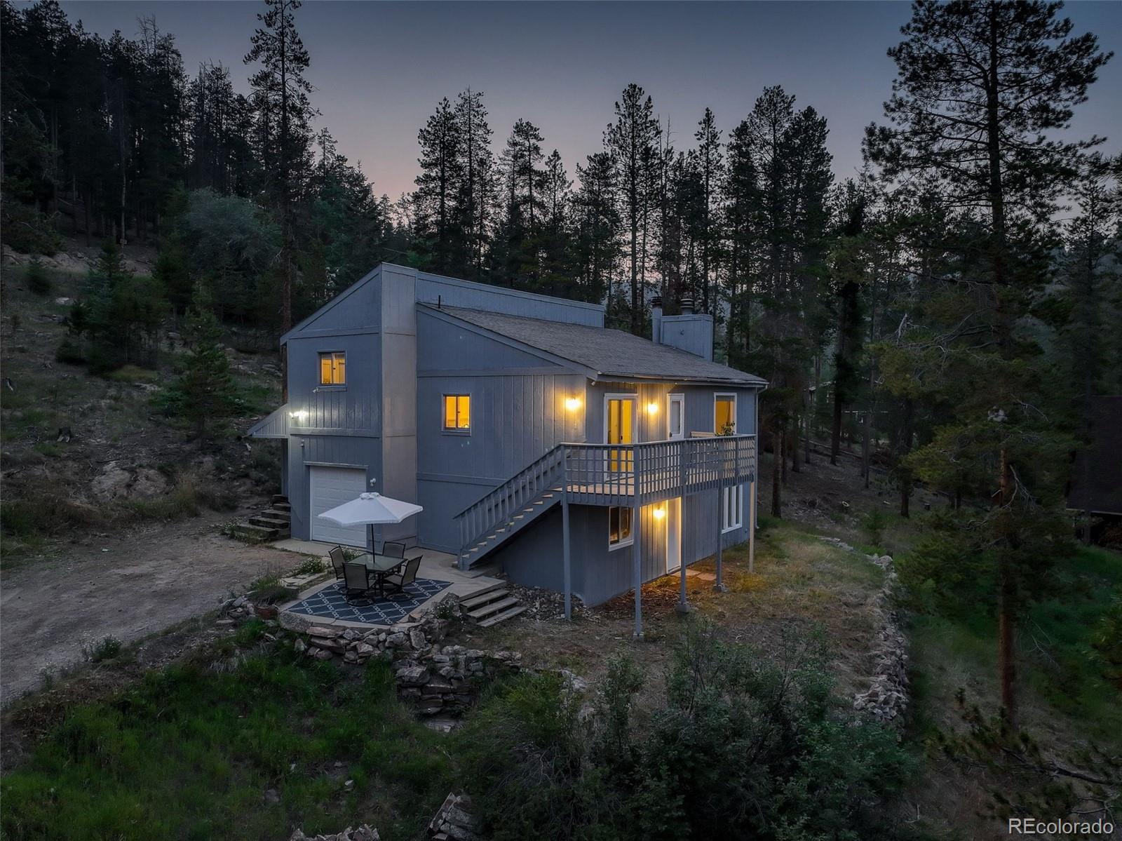 7359 Brook Forest Way Evergreen, CO 80439 - Photo 3 of 40 a view of a house with a yard
