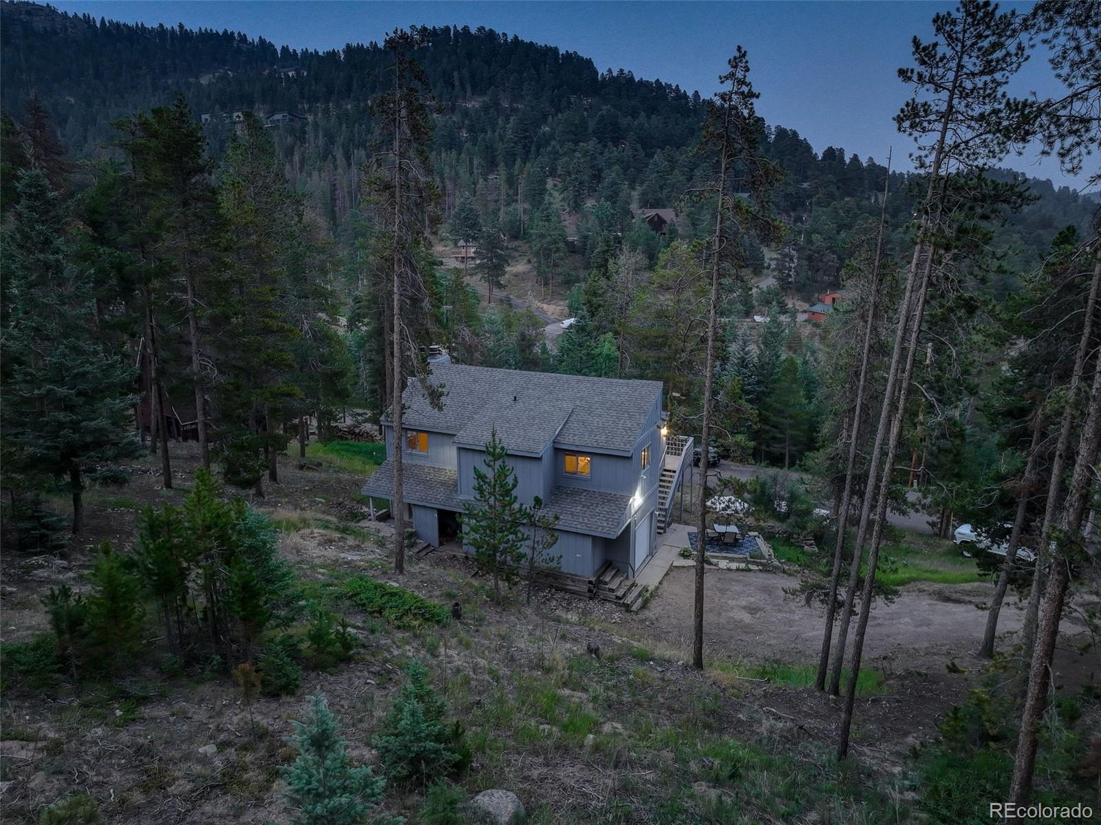7359 Brook Forest Way Evergreen, CO 80439 - Photo 37 of 40 a view of a house with a yard
