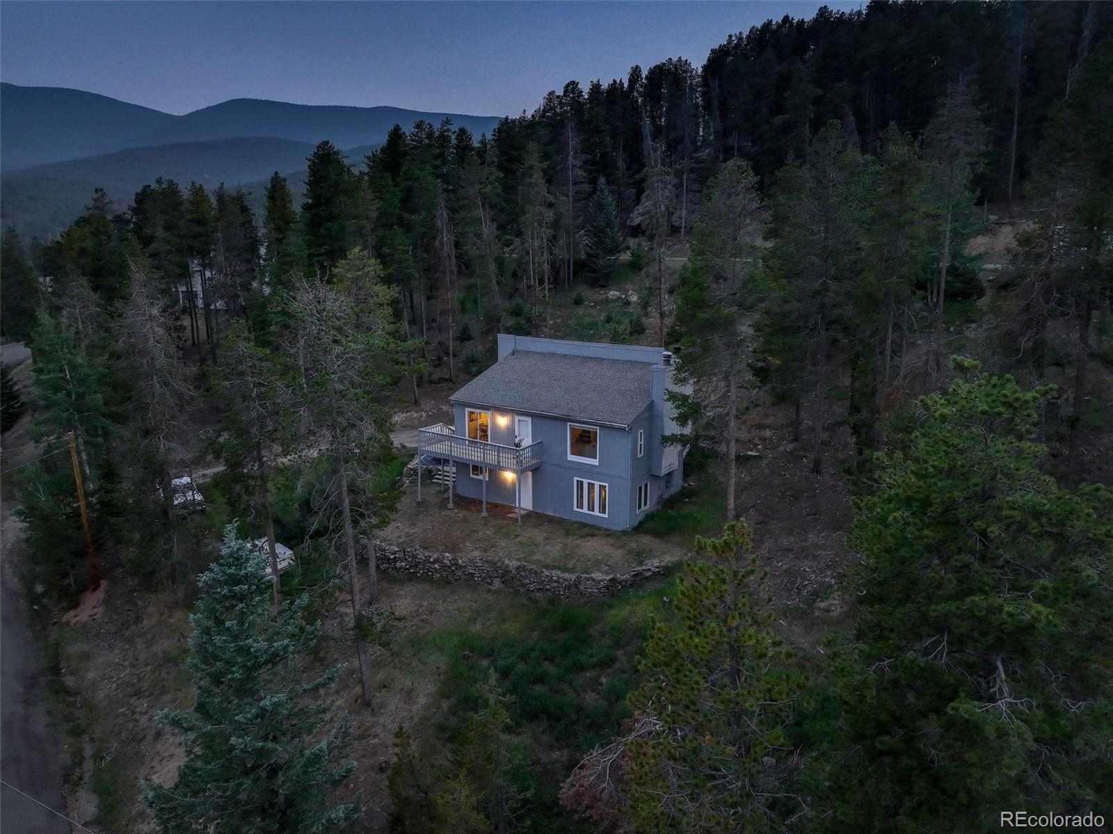 7359 Brook Forest Way Evergreen, CO 80439 - Photo 40 of 40 a view of a house with a yard