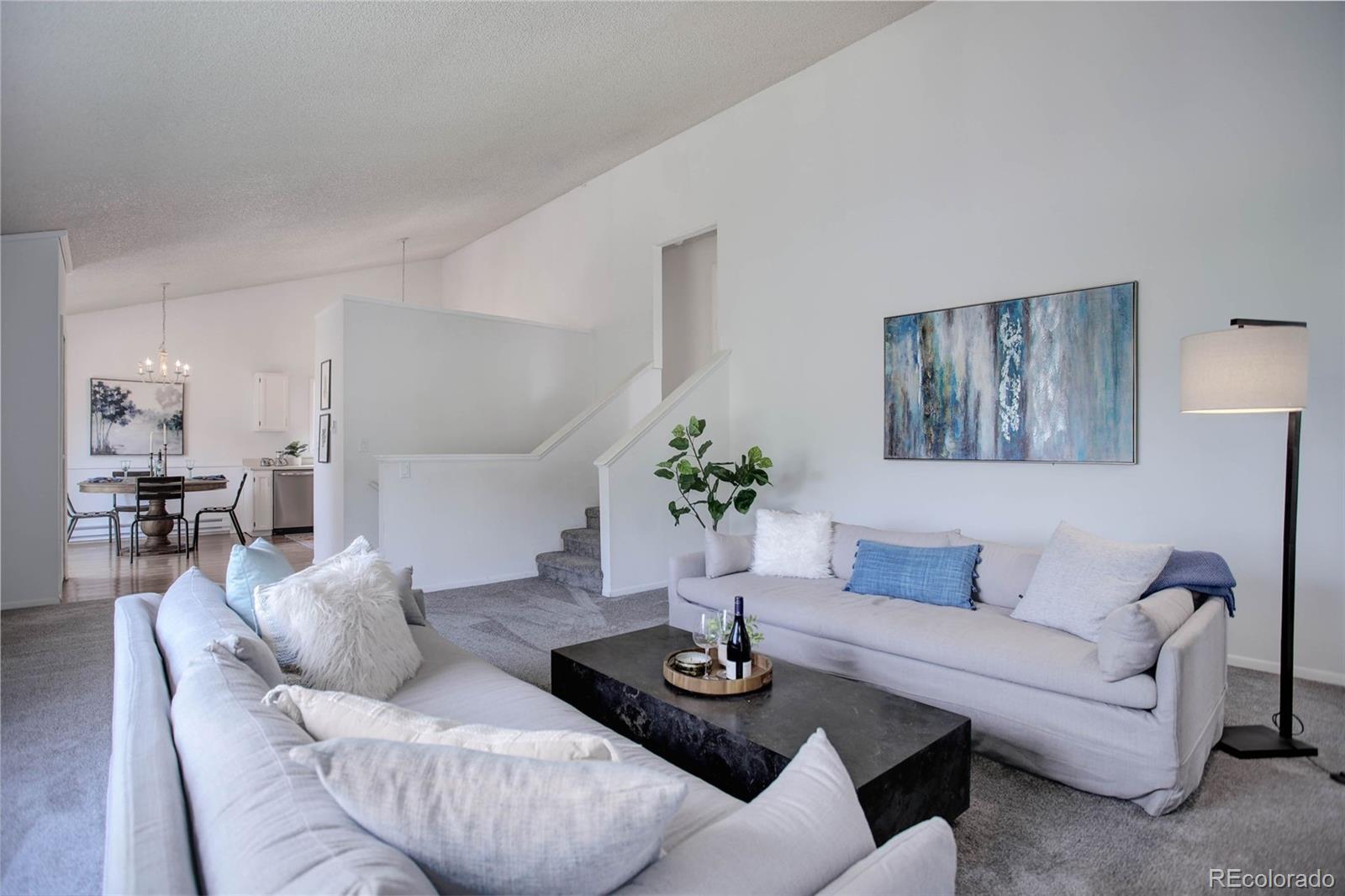 7359 Brook Forest Way Evergreen, CO 80439 - Photo 9 of 40 a living room with furniture and a table