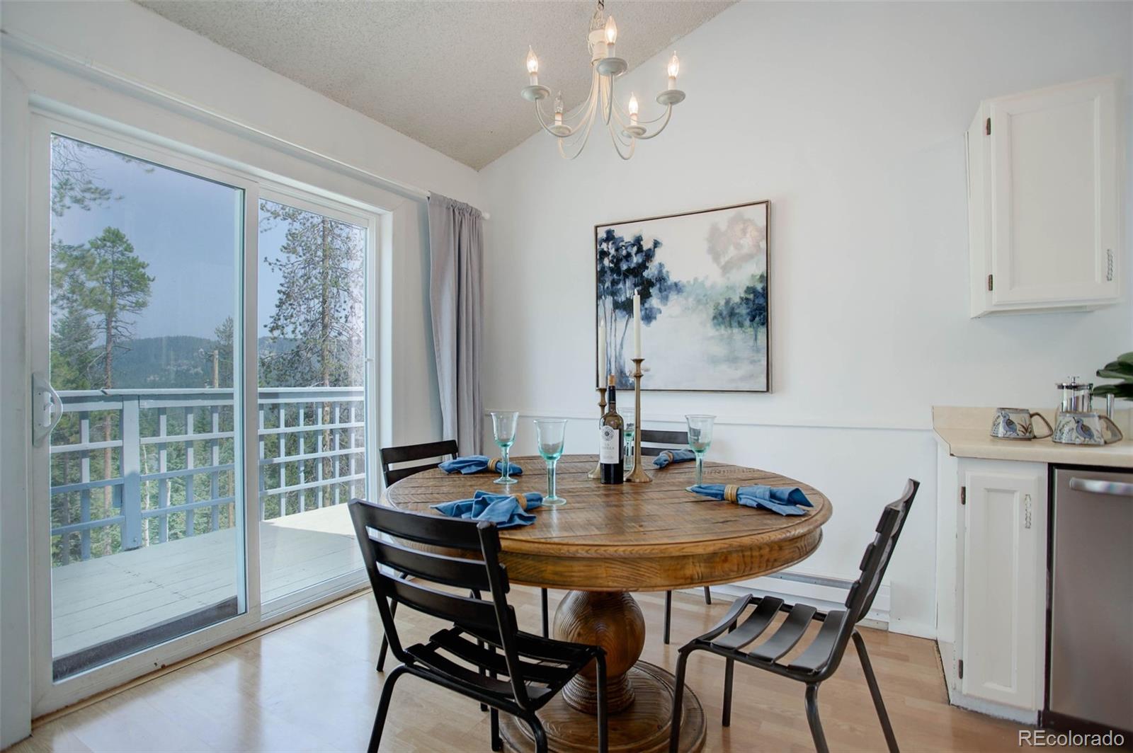 7359 Brook Forest Way Evergreen, CO 80439 - Photo 10 of 40 a dining room with furniture and window