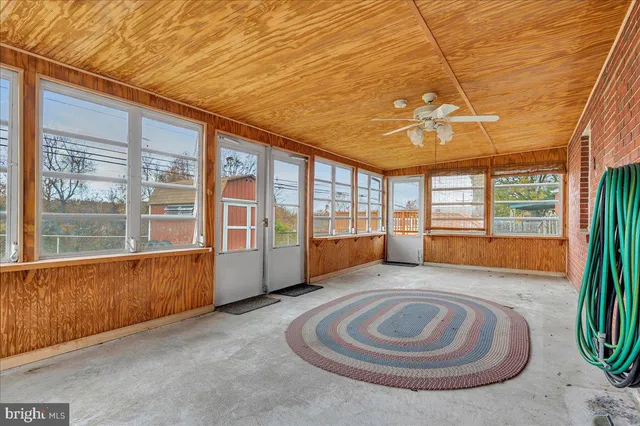 a view of spacious bedroom with a large window