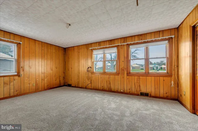 an empty room with windows