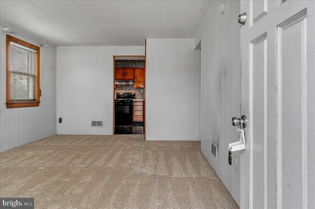 a view of an empty room with a window