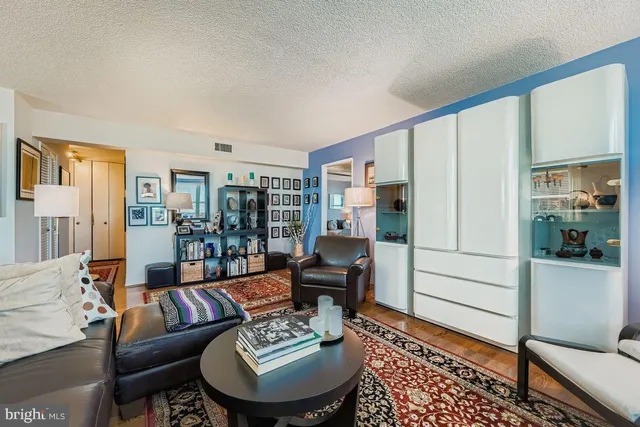 a living room with furniture and a table
