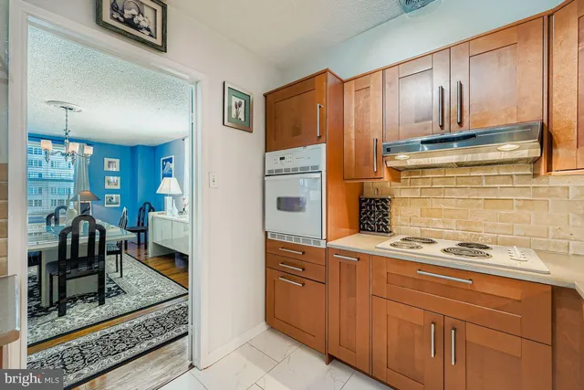 a kitchen with cabinets and appliances