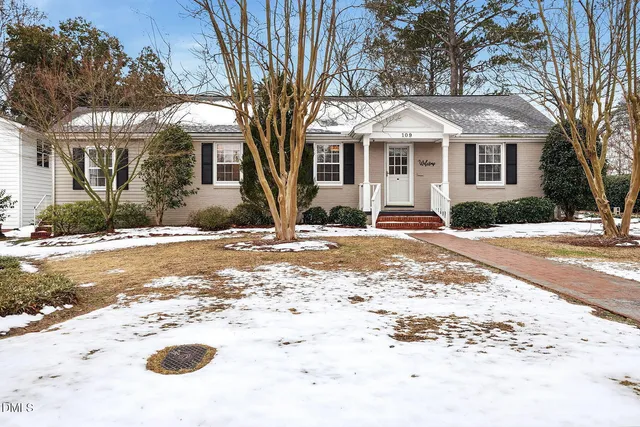a front view of a house with a pathway