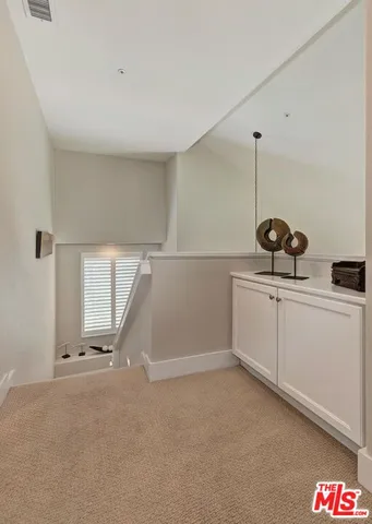 a bedroom with a bed chair and window
