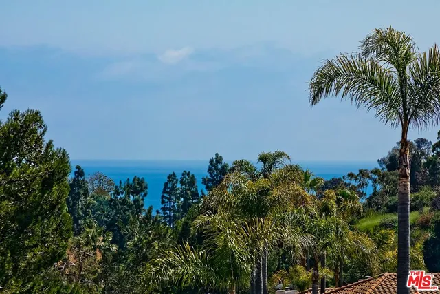 a spacious bathroom with a granite countertop double vanity sink a mirror and a bathtub
