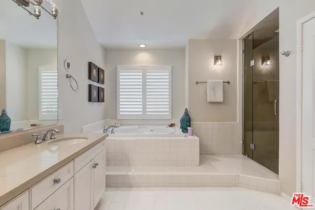 a bedroom with a bed and a painting