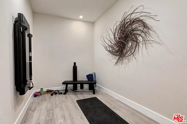 a view of a house with porch and garden