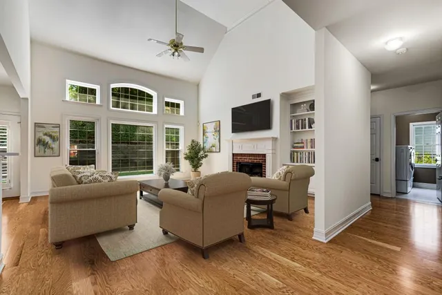 a view of livingroom with furniture workspace and window