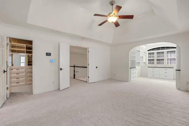 a view of kitchen with stainless steel appliances cabinets and a refrigerator