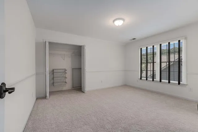 a bathroom with double vanity sinks and a mirror