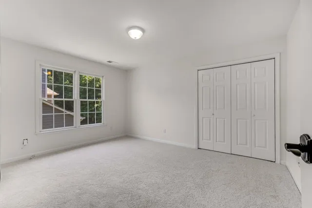 a view of a house with a yard and porch