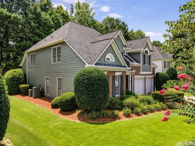 an aerial view of a house with outdoor space