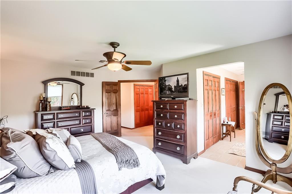 200 Holyoke Road Butler, PA 16001 - Photo 16 of 25 a bedroom with a bed a dresser and a chandelier