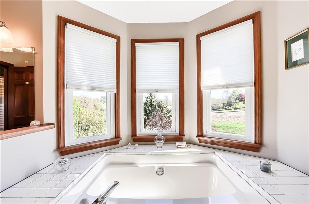 200 Holyoke Road Butler, PA 16001 - Photo 17 of 25 a white bath tub sitting in a bathroom next to a window