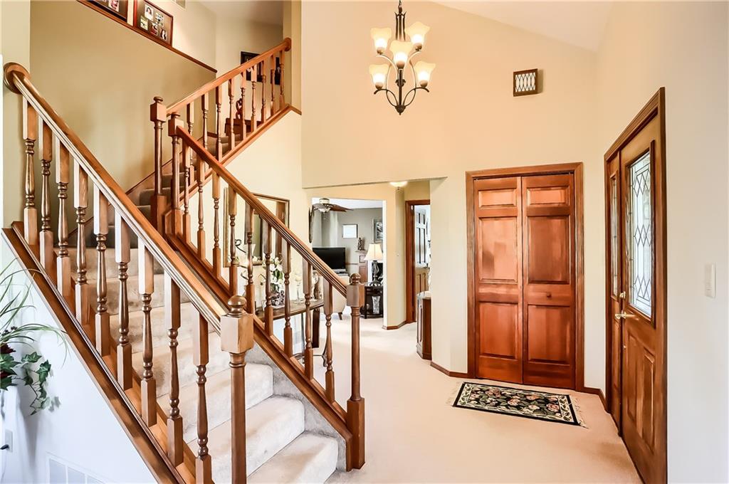200 Holyoke Road Butler, PA 16001 - Photo 3 of 25 a view of staircase with lots of frames on wall and a dining table