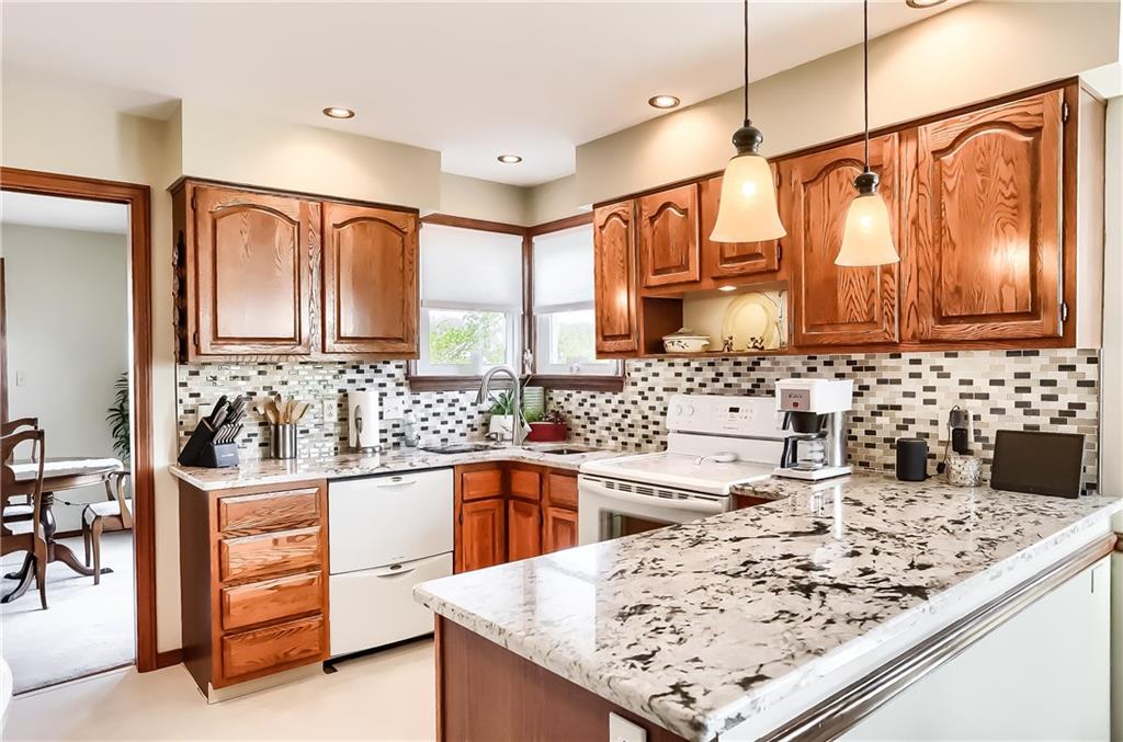 200 Holyoke Road Butler, PA 16001 - Photo 8 of 25 a kitchen with stainless steel appliances kitchen island granite countertop a sink and cabinets