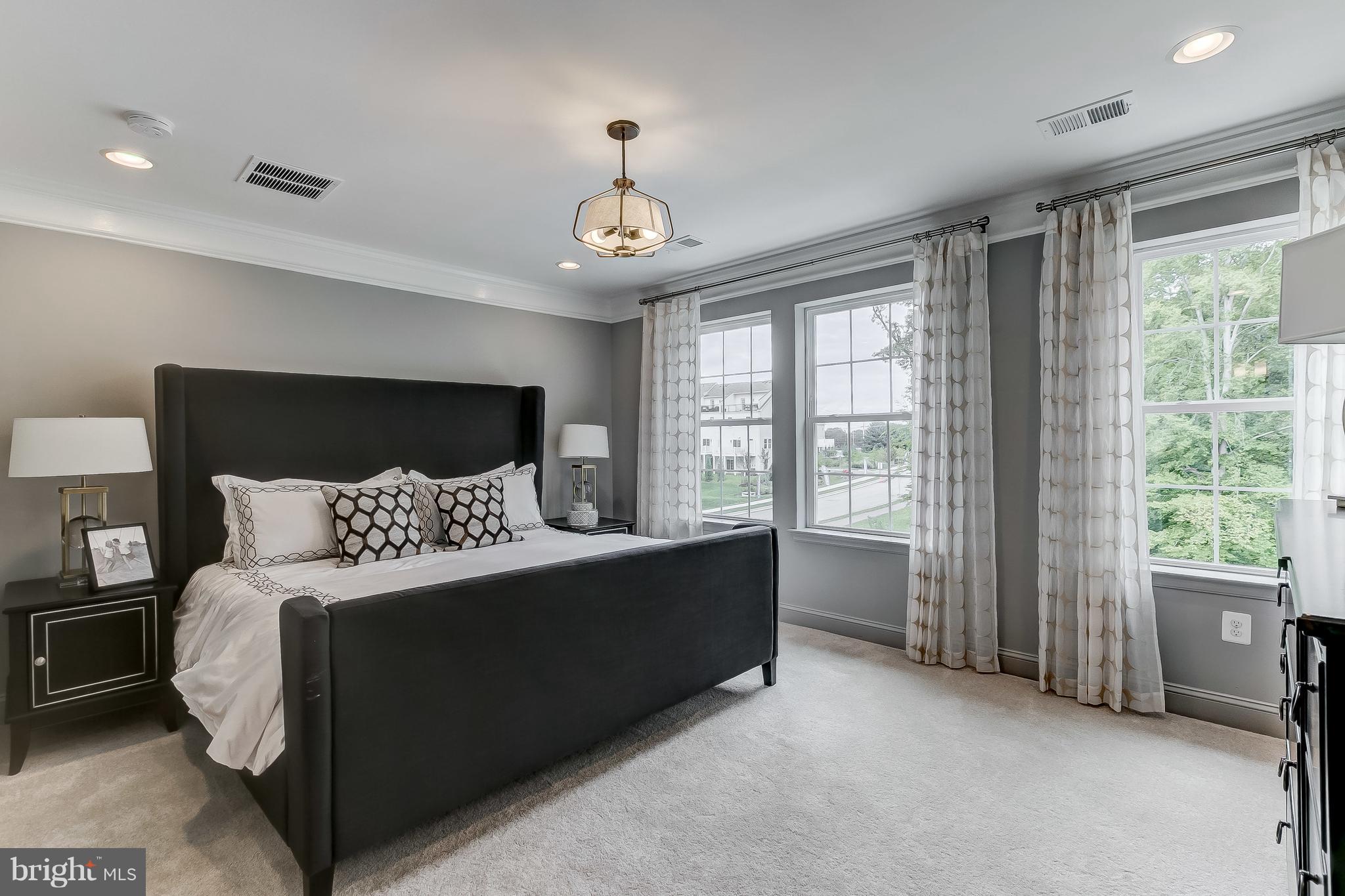 2710 Lady Slipper Road Gambrills, MD 21054 - Photo 17 of 46 a spacious bedroom with a bed and a large window