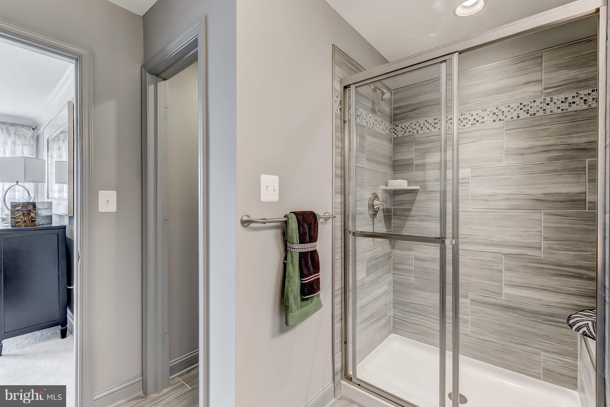 2710 Lady Slipper Road Gambrills, MD 21054 - Photo 21 of 46 a bathroom with a glass shower door