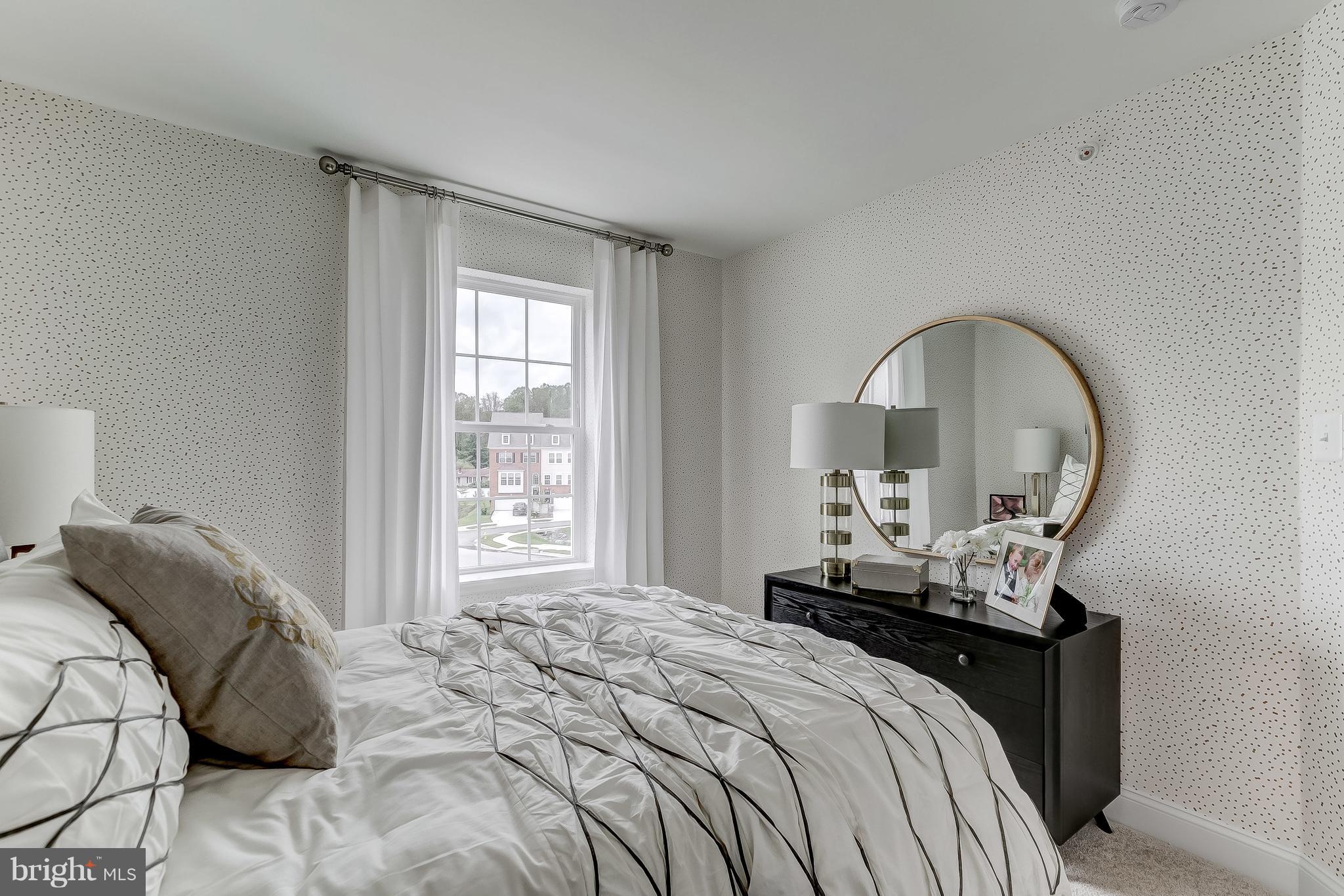 2710 Lady Slipper Road Gambrills, MD 21054 - Photo 26 of 46 a bedroom with a bed and a mirror