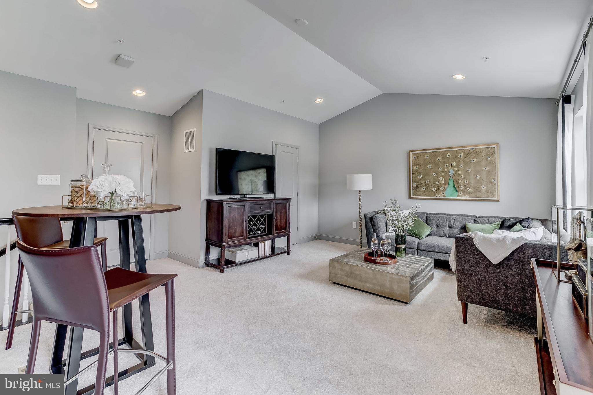 2710 Lady Slipper Road Gambrills, MD 21054 - Photo 28 of 46 a living room with furniture and a flat screen tv