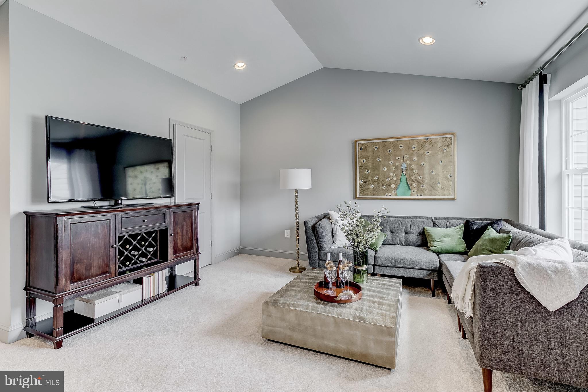 2710 Lady Slipper Road Gambrills, MD 21054 - Photo 29 of 46 a living room with furniture and a flat screen tv