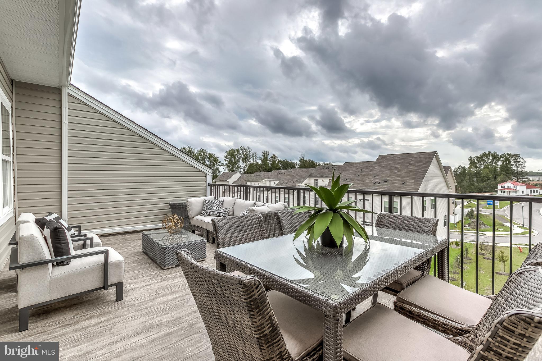 2710 Lady Slipper Road Gambrills, MD 21054 - Photo 33 of 46 a roof deck with couches and wooden floor
