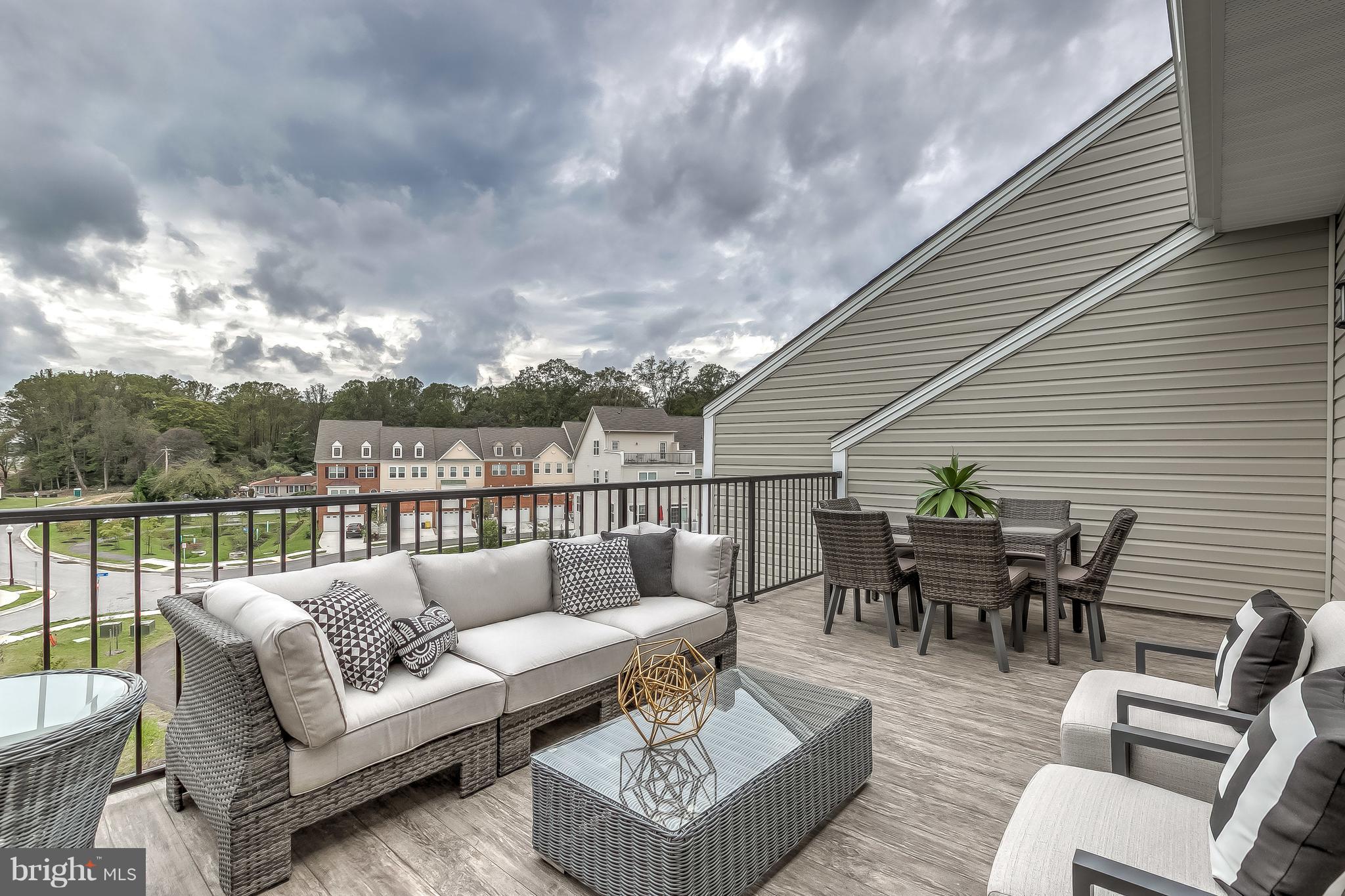 2710 Lady Slipper Road Gambrills, MD 21054 - Photo 35 of 46 a roof deck with couches and potted plants