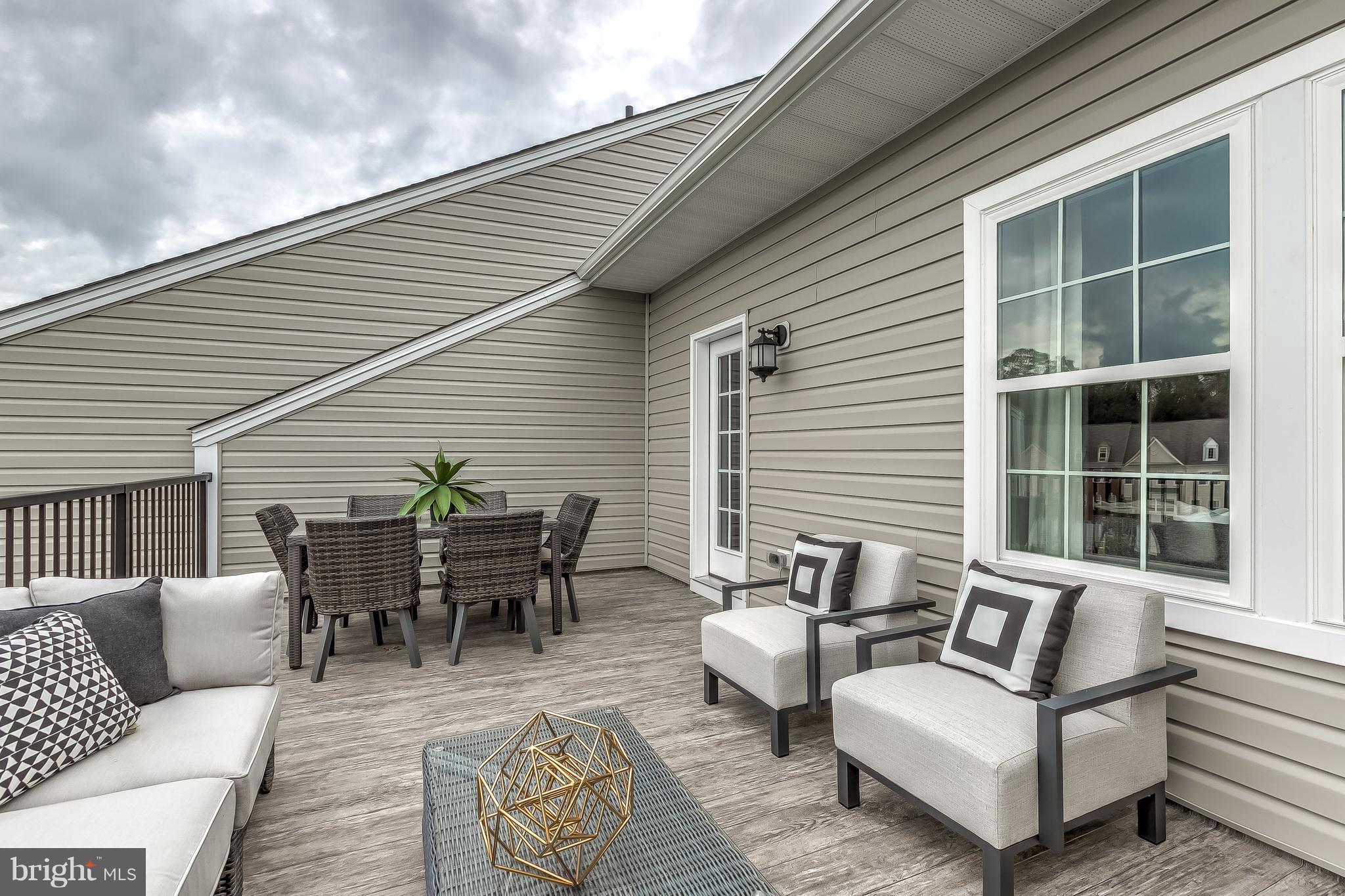 2710 Lady Slipper Road Gambrills, MD 21054 - Photo 36 of 46 a view of a patio with couches and a potted plant