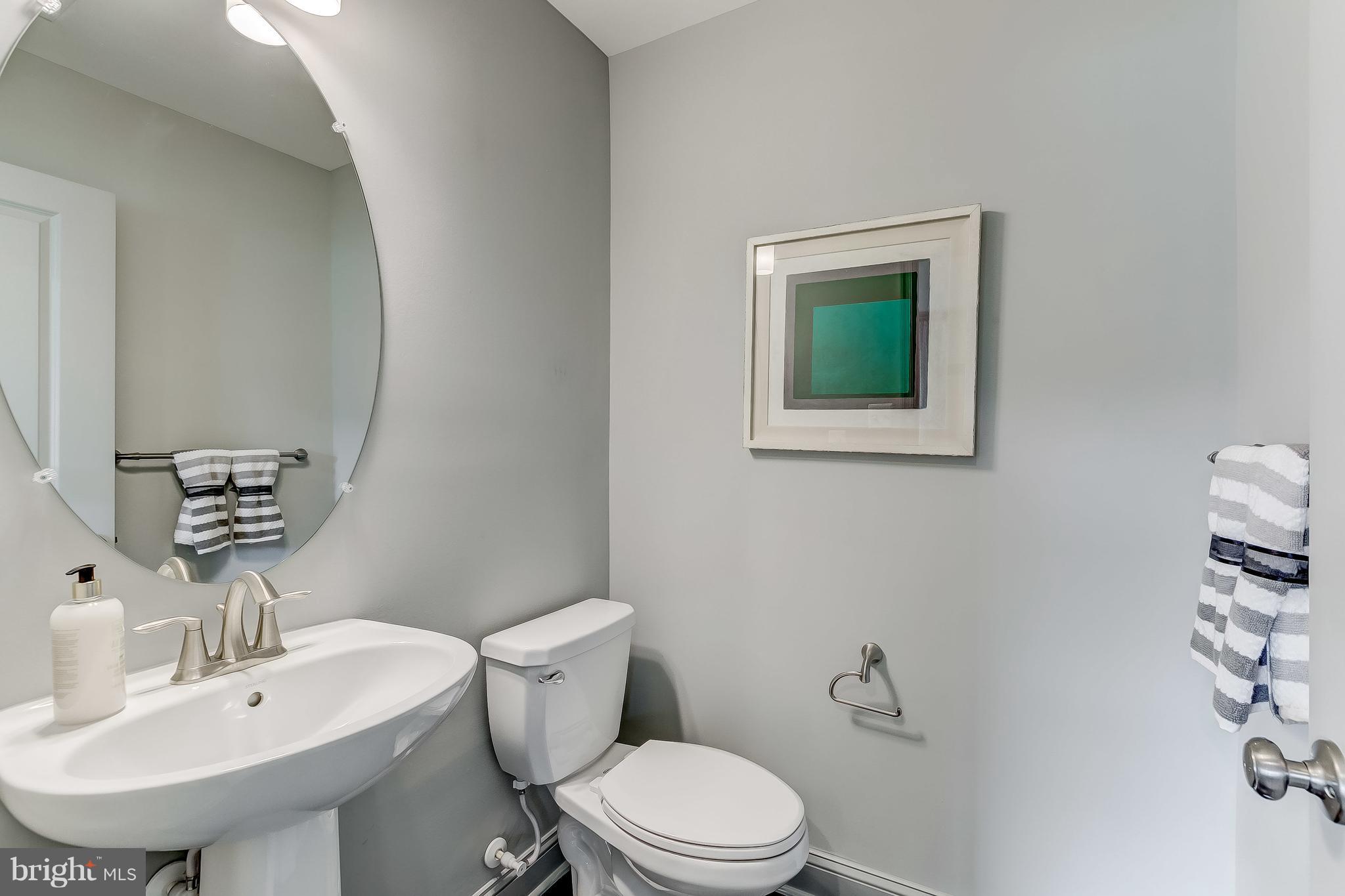 2710 Lady Slipper Road Gambrills, MD 21054 - Photo 44 of 46 a bathroom with a sink mirror and toilet