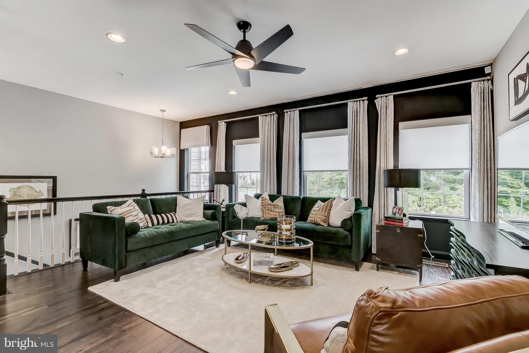 2710 Lady Slipper Road Gambrills, MD 21054 - Photo 5 of 46 a living room with furniture and floor to ceiling windows