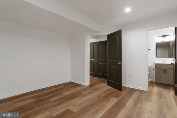 a view of a livingroom with wooden floor