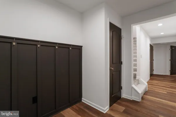 a view of hallway with wooden floor