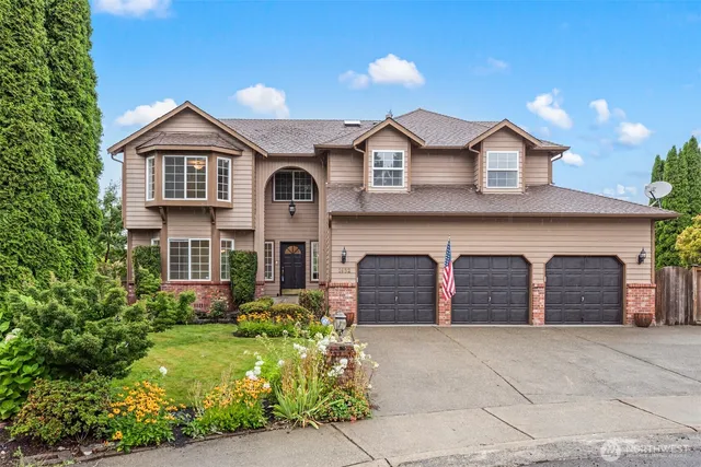 a front view of a house with garden
