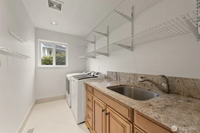 a view of an empty room and kitchen