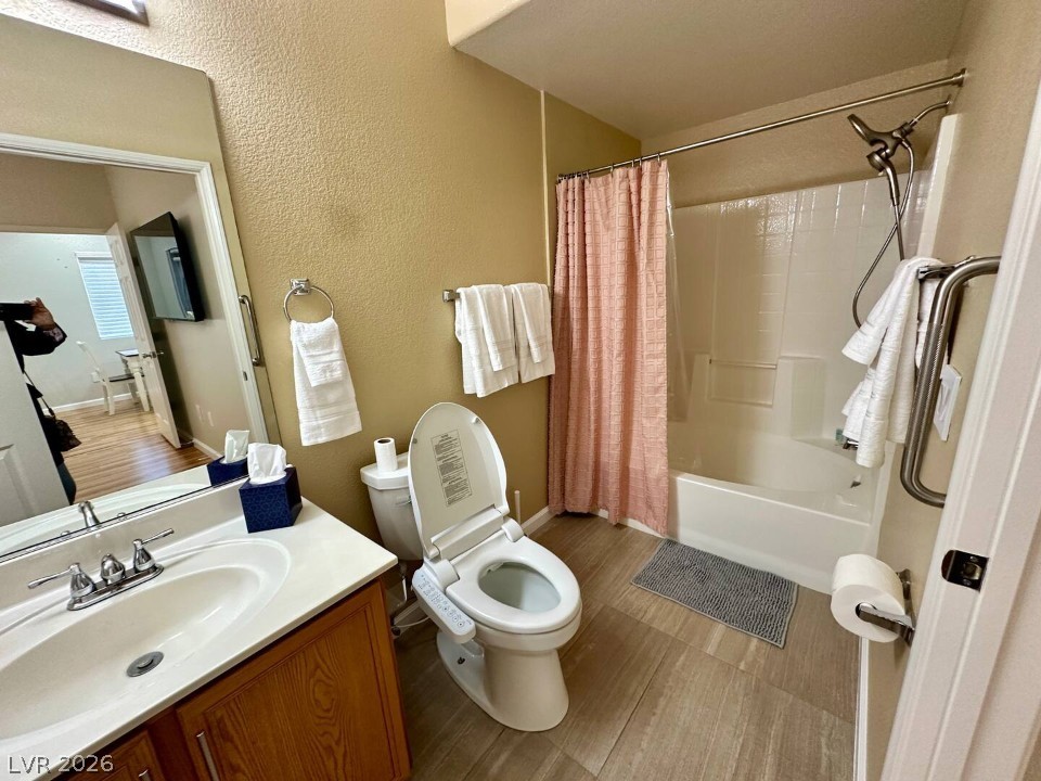 9580 West Reno Avenue, Unit 169 Las Vegas, NV 89148 - Photo 9 of 15 A well-appointed bathroom with durable flooring and modern fixtures awaits.