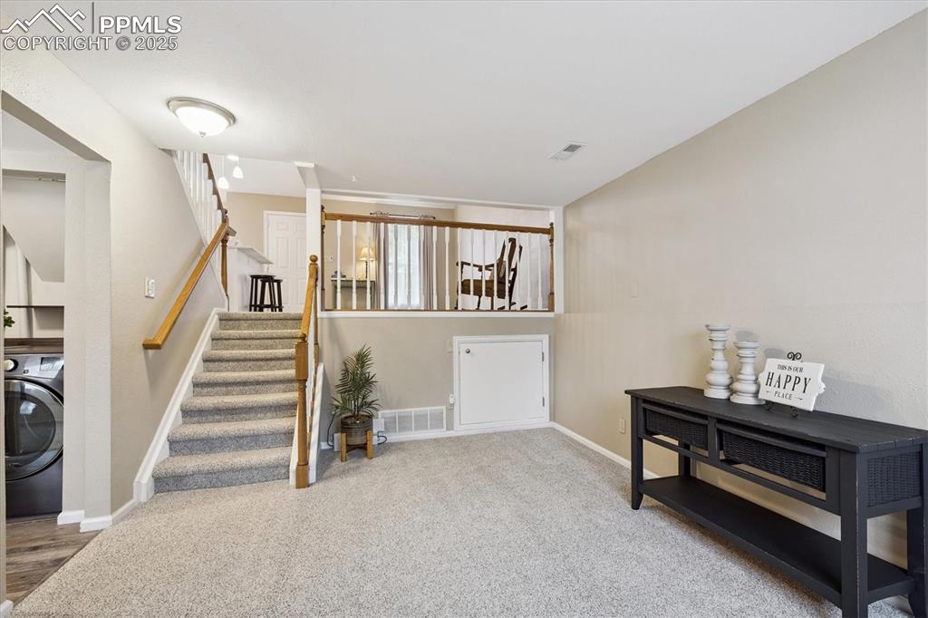 704 Madison Way Bennett, CO 80102 - Photo 16 of 29 a room with stairs and furniture