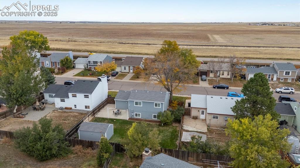 704 Madison Way Bennett, CO 80102 - Photo 27 of 29 an aerial view of residential houses with outdoor space and ocean view