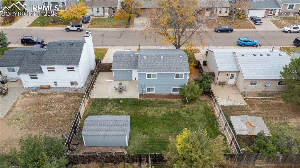 704 Madison Way Bennett, CO 80102 - Photo 29 of 29 an aerial view of residential houses with outdoor space and parking