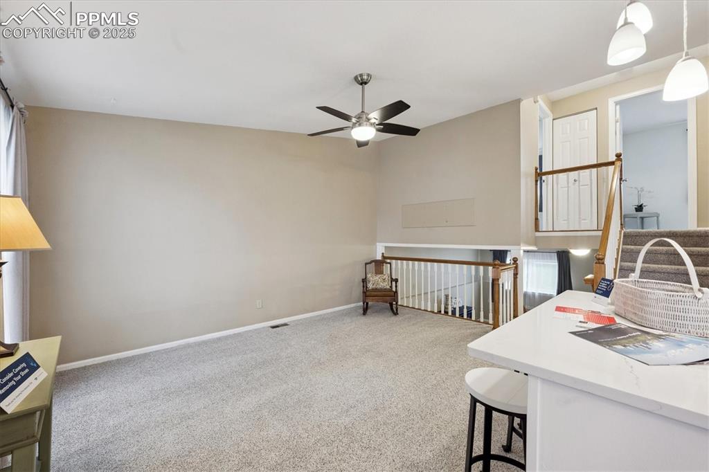 704 Madison Way Bennett, CO 80102 - Photo 5 of 29 a workspace with furniture and window