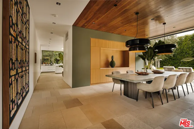 a view of a patio with a table and chairs