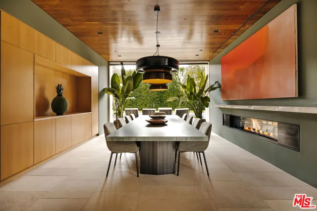 a dining room with furniture and wooden floor