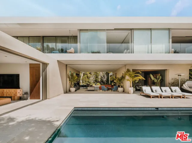 a house view with a sitting space and garden space